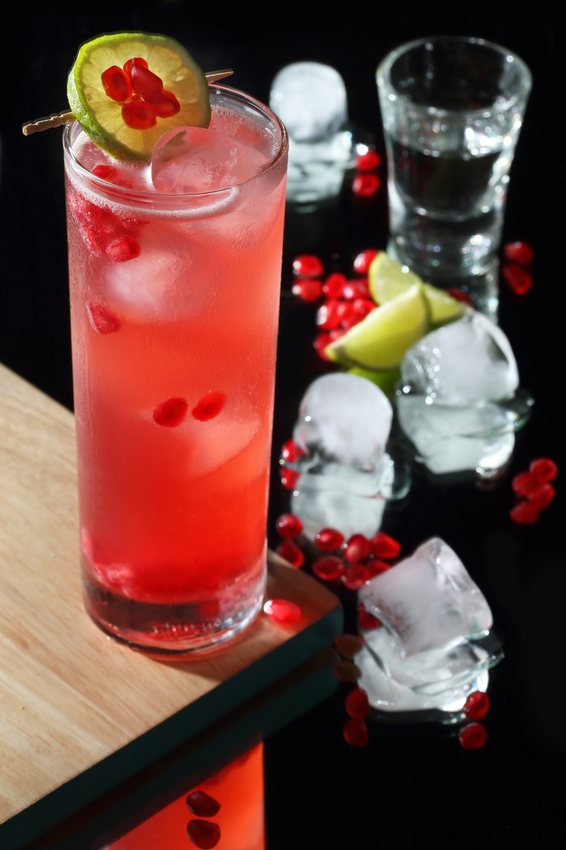 Pomegranate and lime cooler over ice